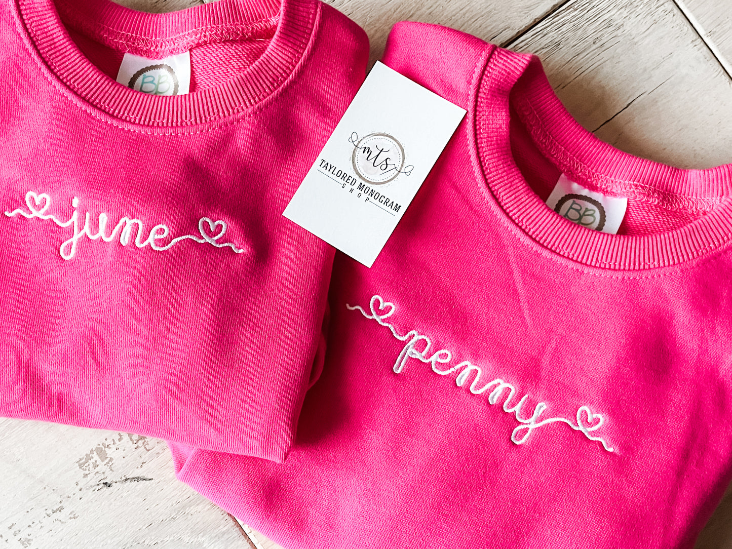 Heart script pullovers